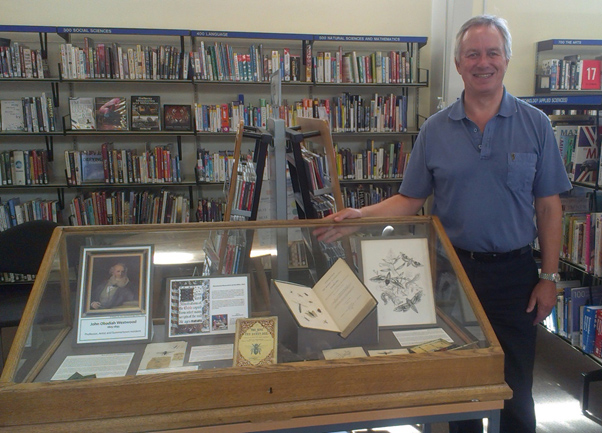 Chairman of the Friends of Summertown Library, Marcus Ferrar, with the display at Summertown Library