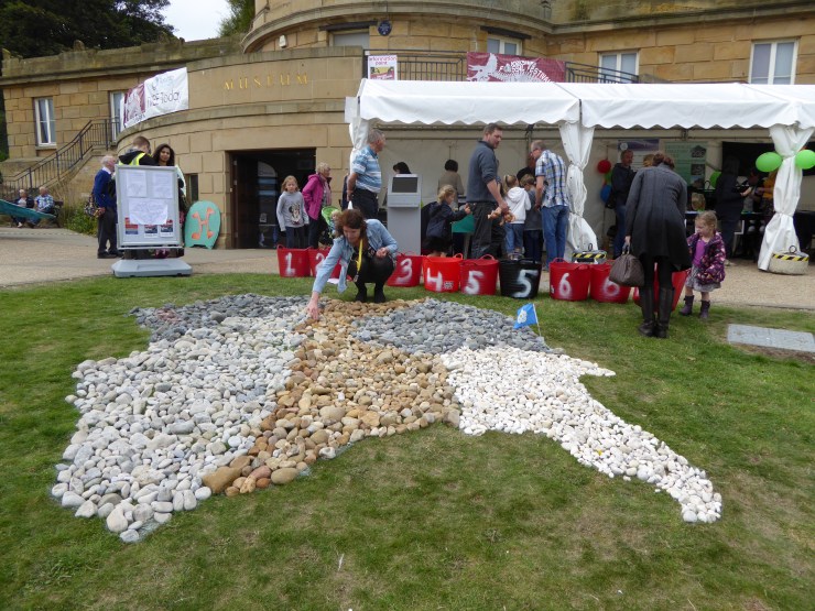 Festival-goers constructing a geological map of Yorkshire using stones. Smith would have been proud!