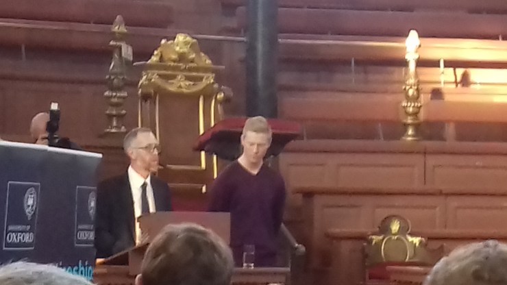 Adam collecting his award at the Sheldonian Theatre in Oxford